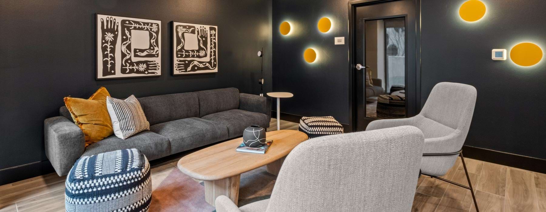 a living room with a couch and chairs