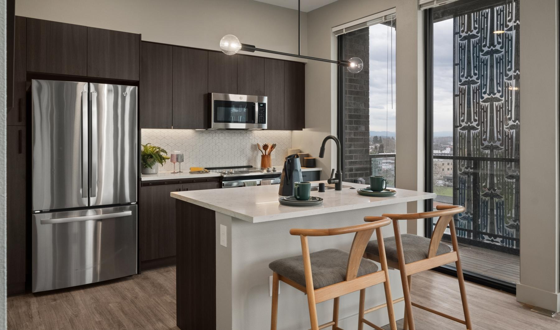 a kitchen with a table and chairs